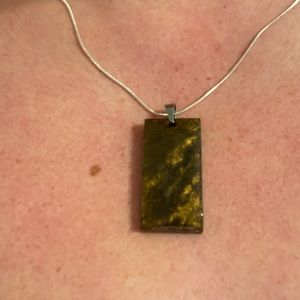 One side is shiny the other matte